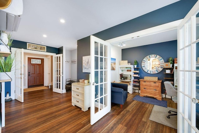 home office with french doors and dark hardwood / wood-style floors