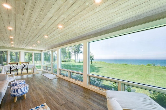 sunroom with a water view and wood ceiling