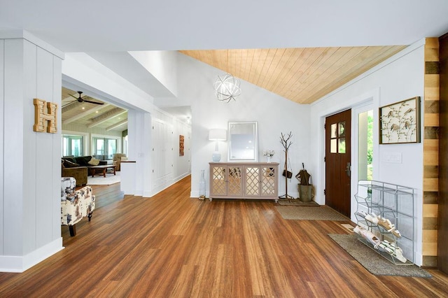 entrance foyer featuring lofted ceiling with beams, wood-type flooring, and plenty of natural light