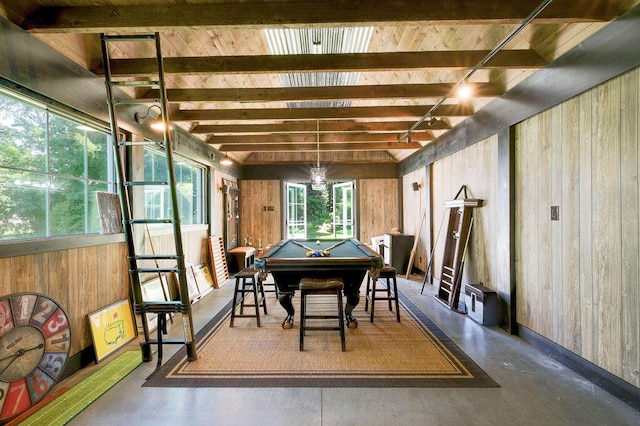 interior space with wood ceiling, wooden walls, pool table, concrete floors, and beamed ceiling