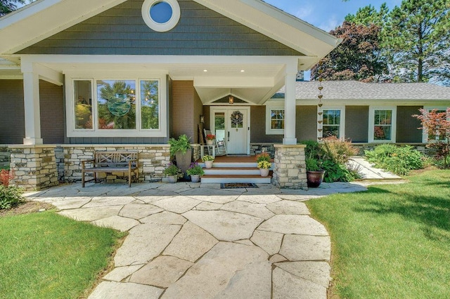 view of front of property with covered porch and a front lawn