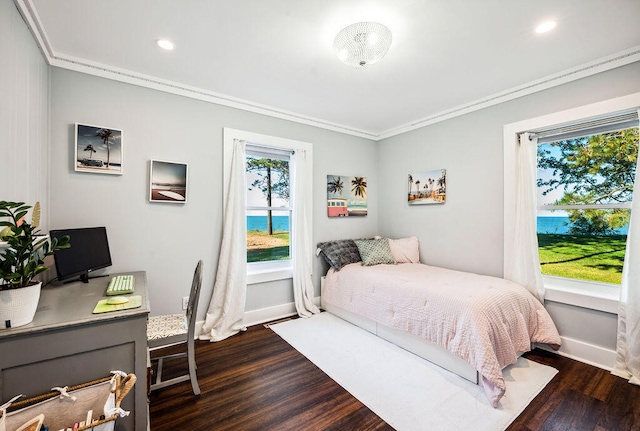 bedroom featuring crown molding and dark hardwood / wood-style floors