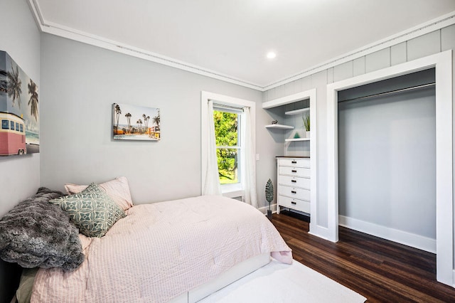 bedroom featuring crown molding and dark wood-type flooring