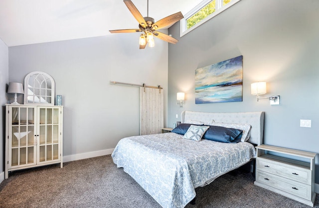 carpeted bedroom featuring high vaulted ceiling, a barn door, and ceiling fan