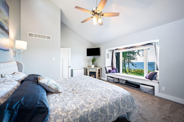 bedroom with high vaulted ceiling, carpet flooring, and ceiling fan