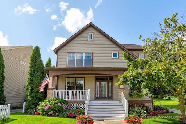 view of front of house featuring a porch and a front lawn