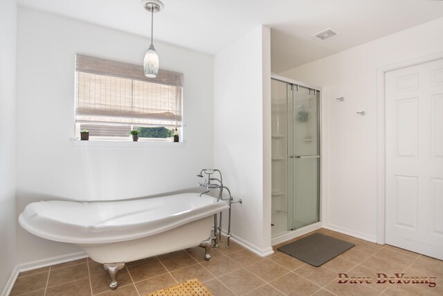 bathroom featuring shower with separate bathtub and tile patterned floors