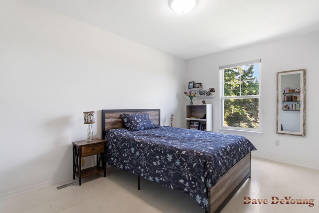 bedroom with light hardwood / wood-style flooring