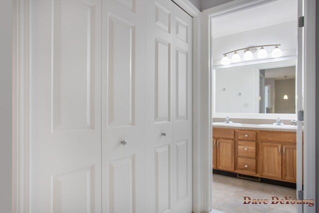 bathroom featuring dual vanity