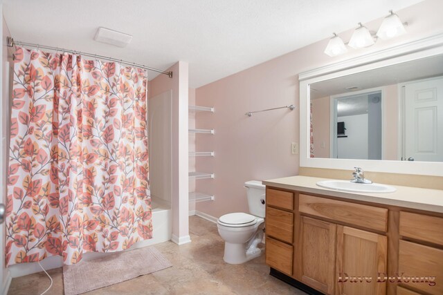 full bathroom with tile patterned flooring, toilet, shower / bathtub combination with curtain, and vanity