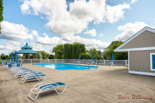 view of pool featuring a patio and a gazebo