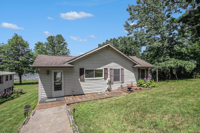 ranch-style house with a front lawn