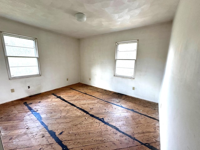 empty room featuring hardwood / wood-style flooring