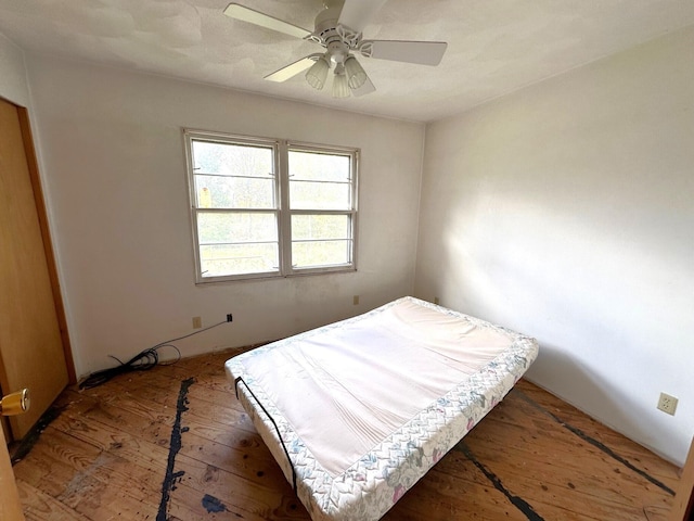 bedroom with hardwood / wood-style flooring and ceiling fan