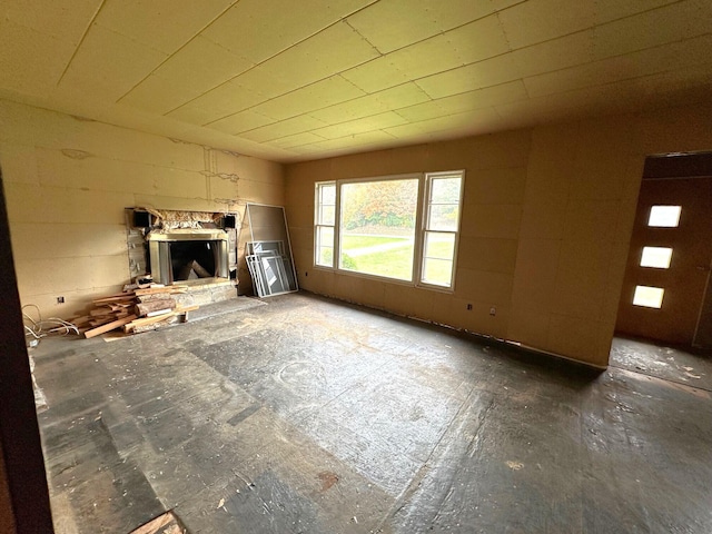 unfurnished living room with a fireplace