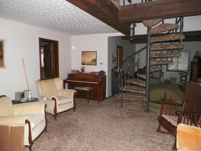 living room featuring carpet floors and a textured ceiling