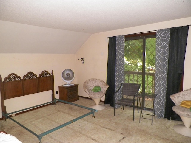 carpeted bedroom with lofted ceiling