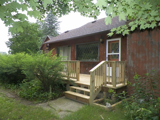 doorway to property with a wooden deck