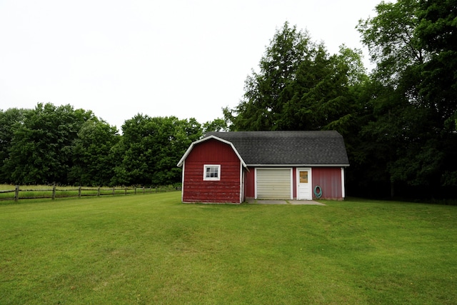 view of outbuilding featuring a yard