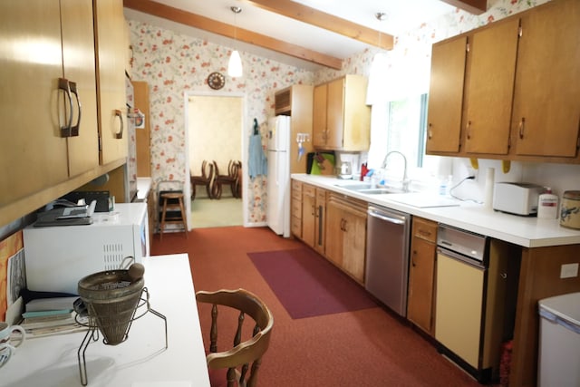 kitchen with pendant lighting, beamed ceiling, sink, white fridge, and stainless steel dishwasher