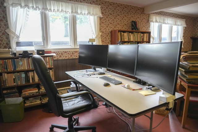 home office featuring beam ceiling