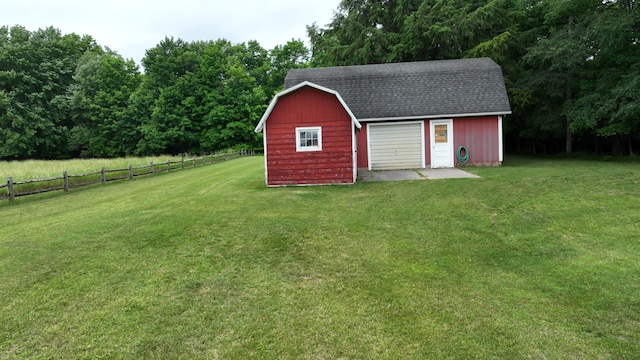 view of outbuilding with a yard