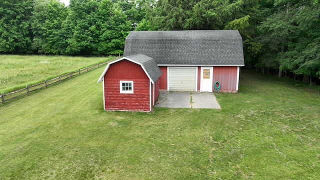 view of outbuilding featuring a yard