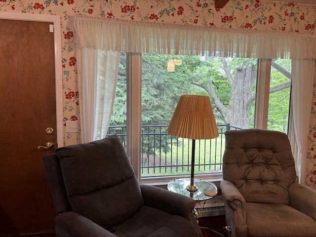 living area featuring baseboard heating