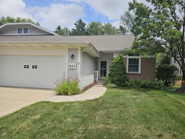 single story home featuring a garage and a front yard