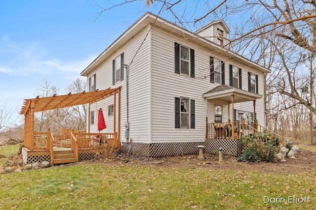 exterior space featuring a yard and a wooden deck