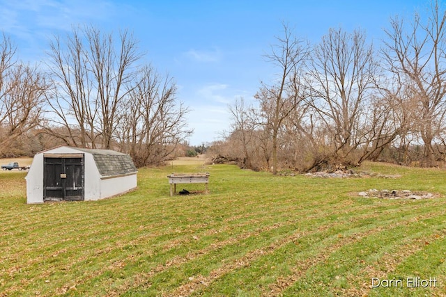 view of yard with an outbuilding and a storage shed