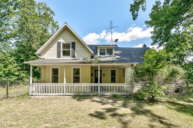 view of front of house featuring a front yard and covered porch