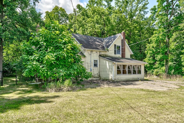 view of home's exterior featuring a lawn