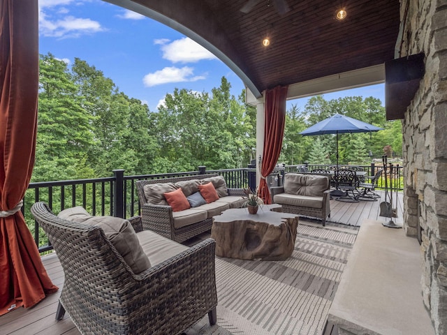 deck featuring outdoor dining space and an outdoor living space