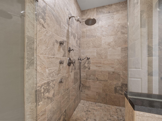 bathroom with tiled shower