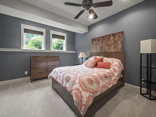 carpeted bedroom featuring a ceiling fan and baseboards