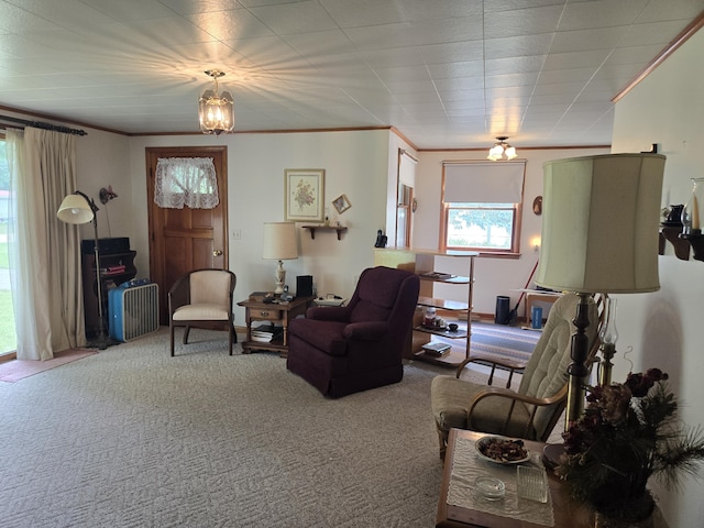 carpeted living room with crown molding