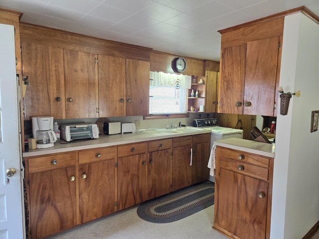 kitchen with sink and washer / dryer