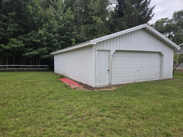 garage featuring a lawn