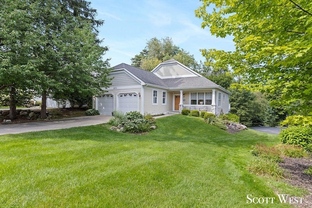 view of front of home with driveway, a garage, a front lawn, and a porch