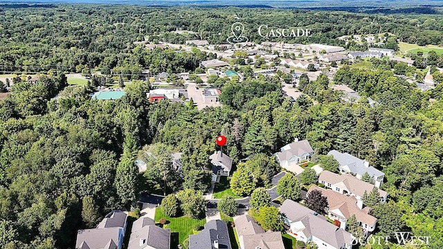 aerial view featuring a residential view and a wooded view