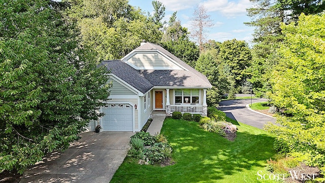 view of front of home featuring a garage, covered porch, and a front lawn