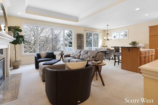 living room featuring a fireplace, light colored carpet, and plenty of natural light