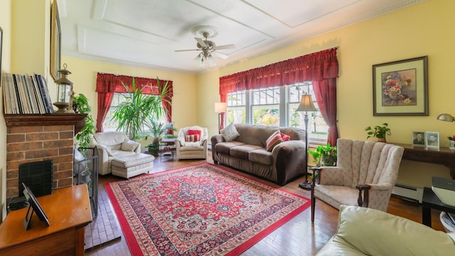 living room with a brick fireplace, a baseboard radiator, hardwood / wood-style floors, and crown molding