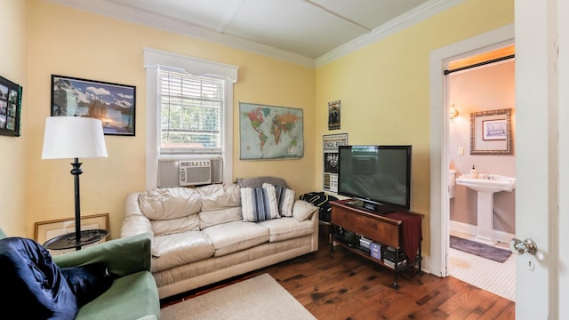 living room with cooling unit, dark hardwood / wood-style flooring, sink, and crown molding