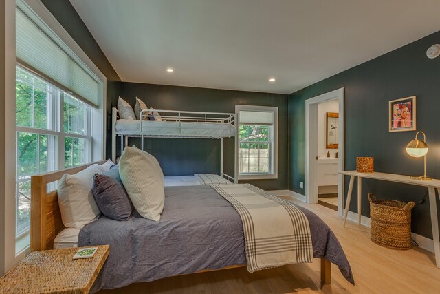 15963 Lakeshore Rd, Union Pier, MI 49129 - bedroom with baseboards, recessed lighting, connected bathroom, and wood finished floors