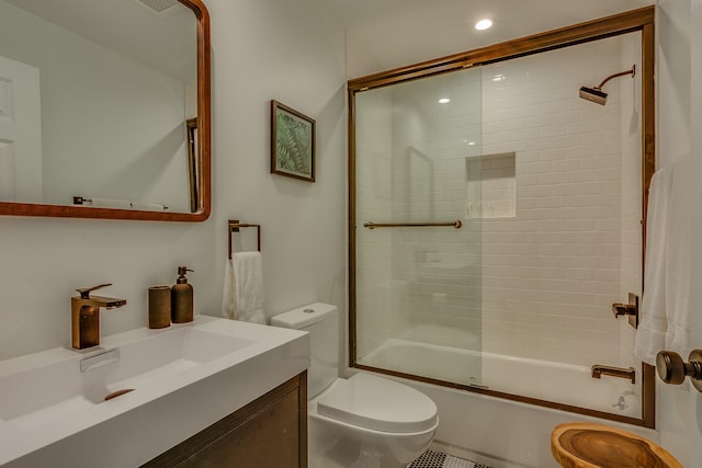 15963 Lakeshore Rd, Union Pier, MI 49129 - bathroom featuring visible vents, combined bath / shower with glass door, toilet, recessed lighting, and vanity