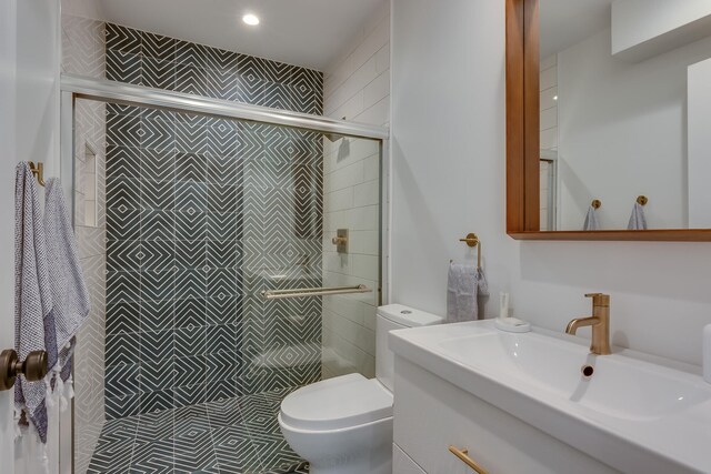 15963 Lakeshore Rd, Union Pier, MI 49129 - full bathroom with toilet, a shower stall, and vanity