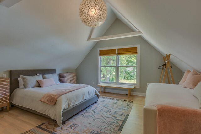 15963 Lakeshore Rd, Union Pier, MI 49129 - bedroom featuring light wood finished floors and vaulted ceiling