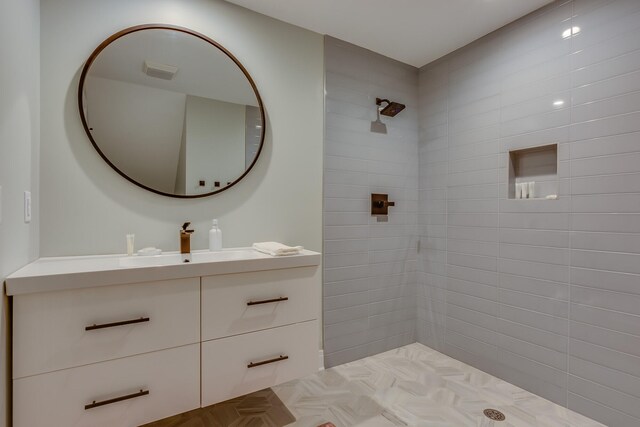 15963 Lakeshore Rd, Union Pier, MI 49129 - bathroom with visible vents, tiled shower, and vanity